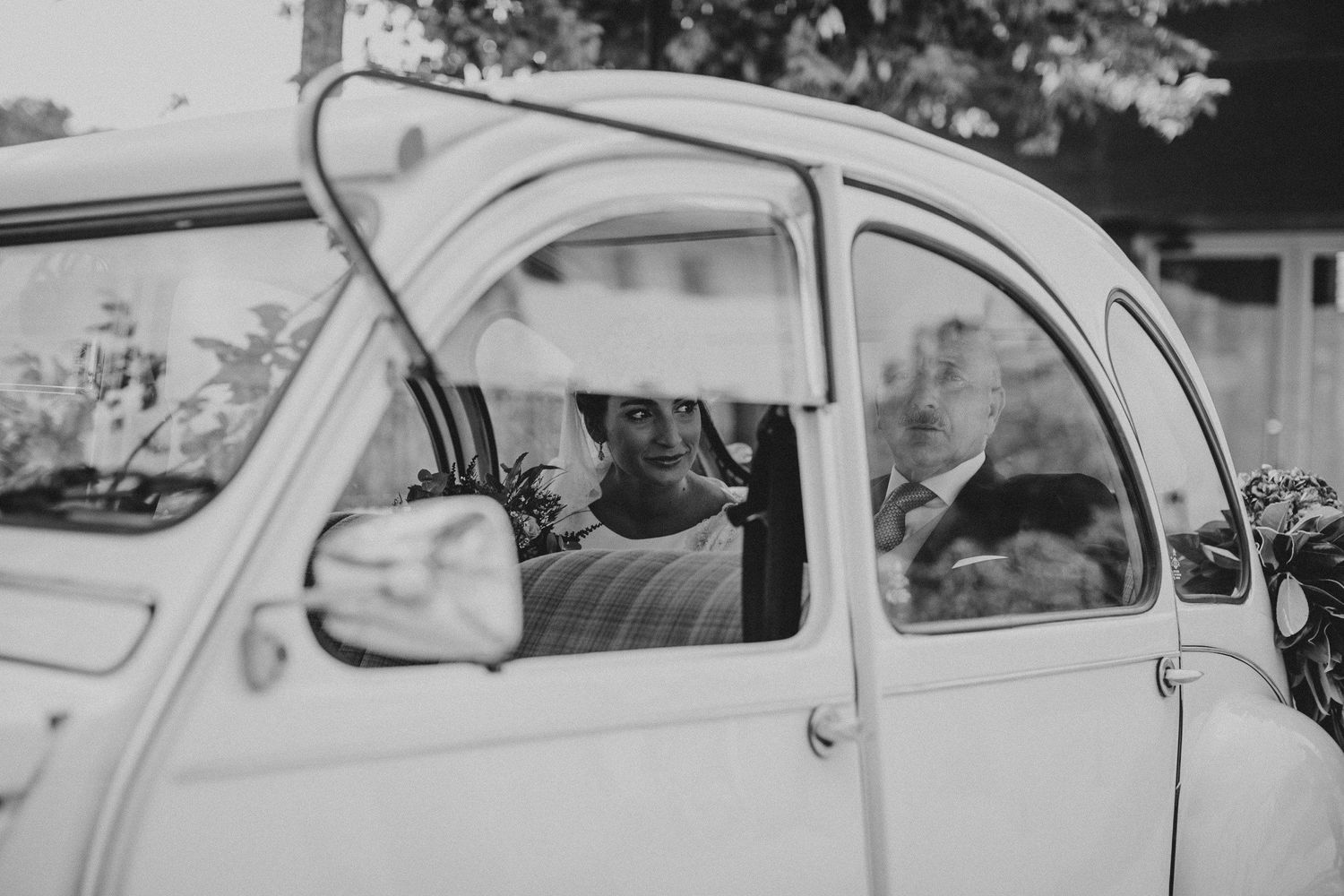 Vintage Citroen 2CV car captured in black and white photography.