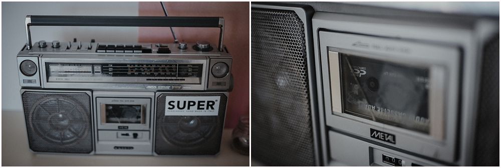 Vintage boombox and cassette player against gray background.