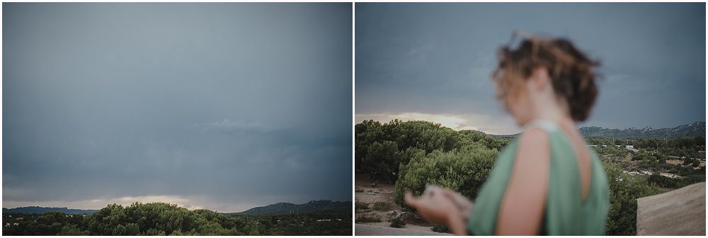 Dramatic stormy skies over coastal landscape.