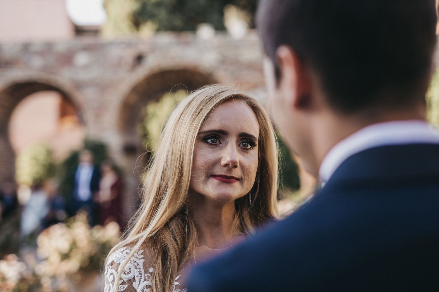 Close-up wedding portrait showing couple sharing an intimate moment outdoors.