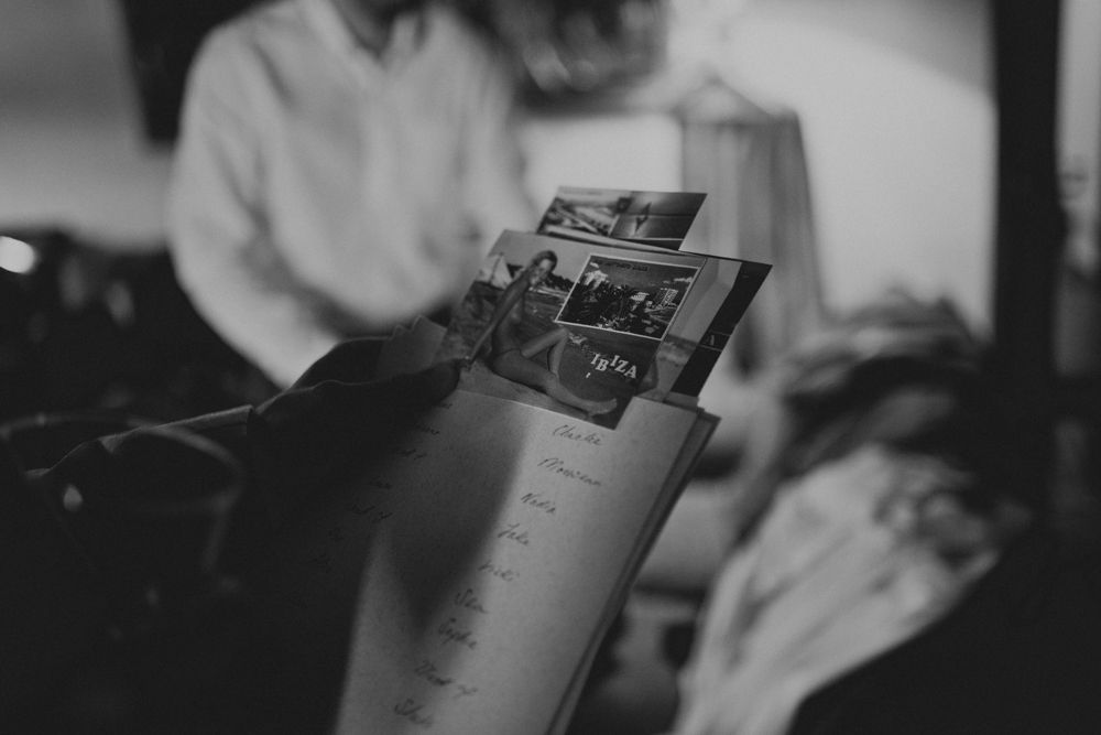 Black and white close-up of someone holding a photograph.