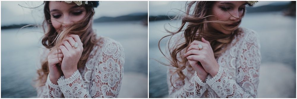 A romantic close-up portrait in lace featuring soft moody lighting and windswept hair.