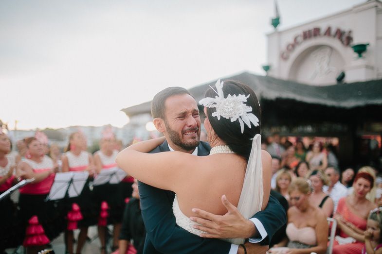 A joyful moment captured during a first dance at an outdoor wedding reception.