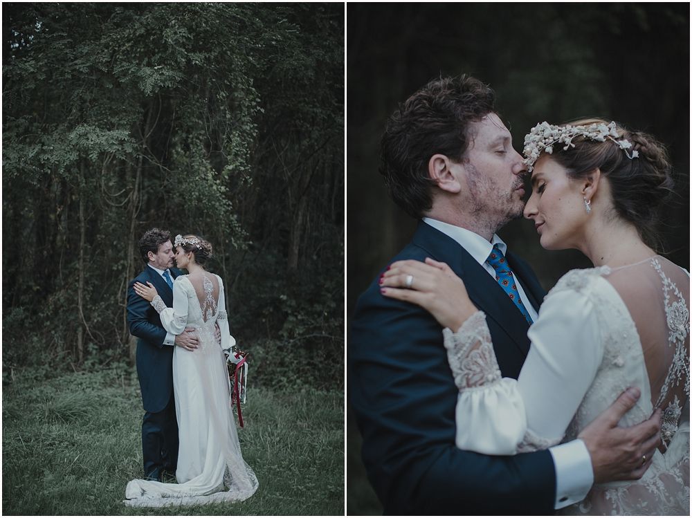 Atmospheric wedding portraits showing tender moments in forest setting.