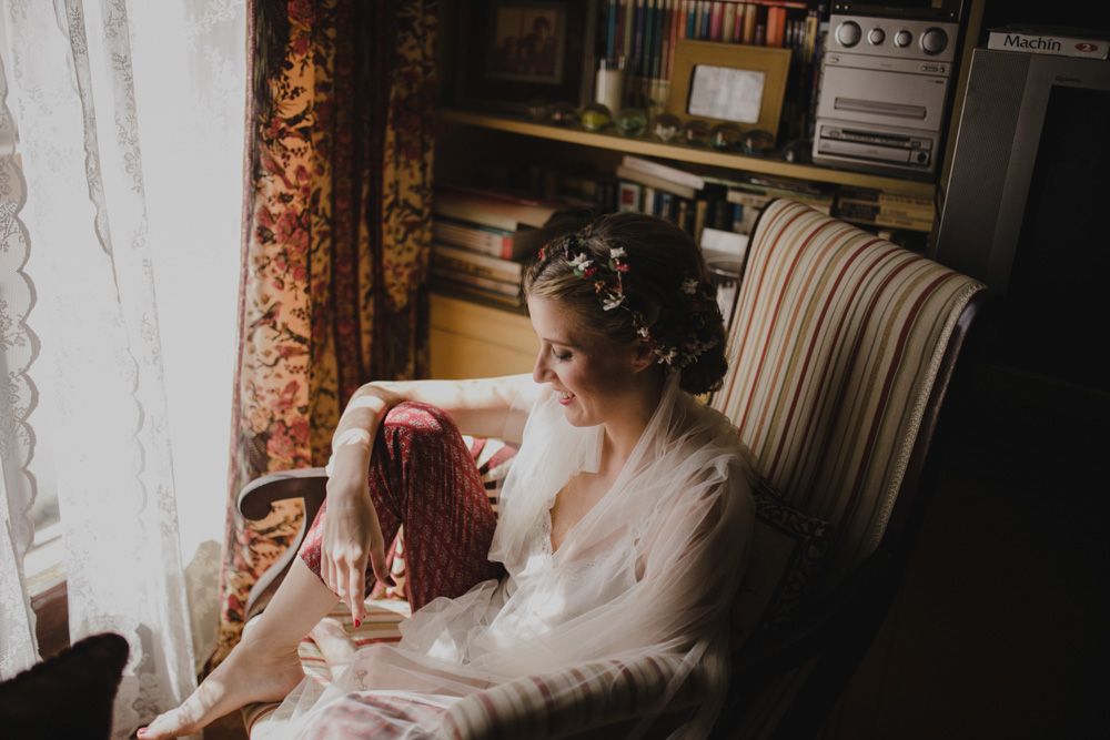 Morning wedding preparation scene in a cozy corner with natural window light.