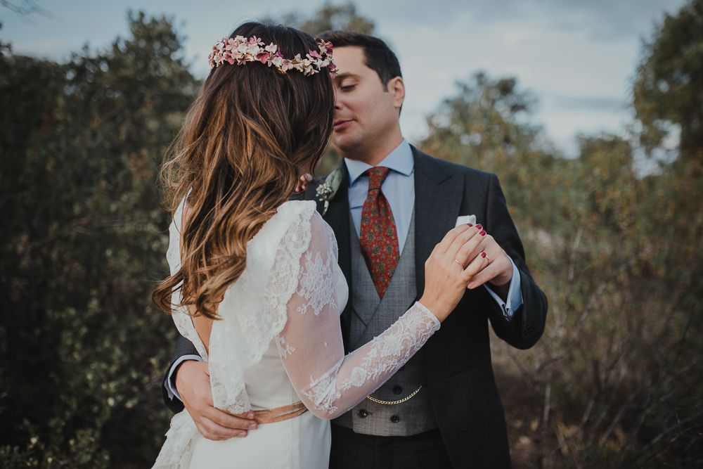 Intimate wedding dance moment captured in natural outdoor setting.