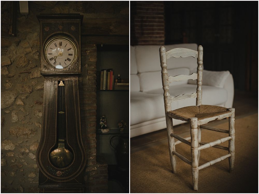 Vintage grandfather clock and distressed white wooden chair create a nostalgic interior scene.