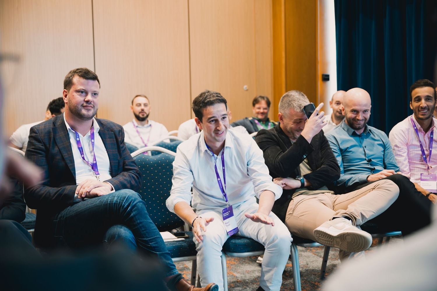 Conference attendees participating in group discussion at business event.