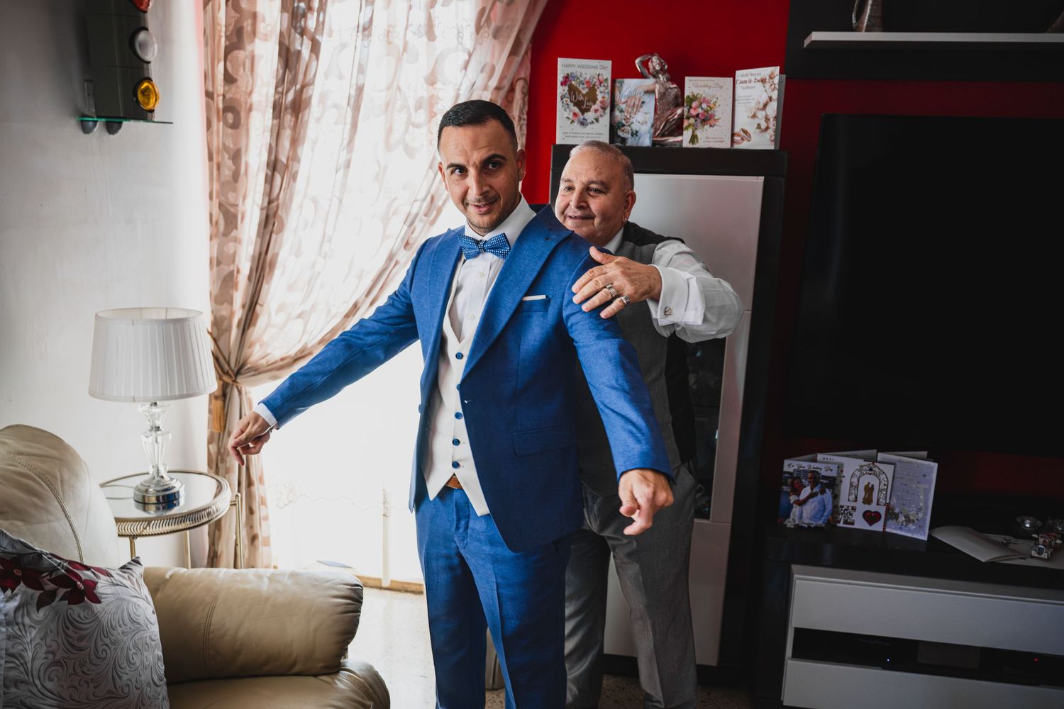 Series of wedding preparation photos showing groom getting ready in blue suit.