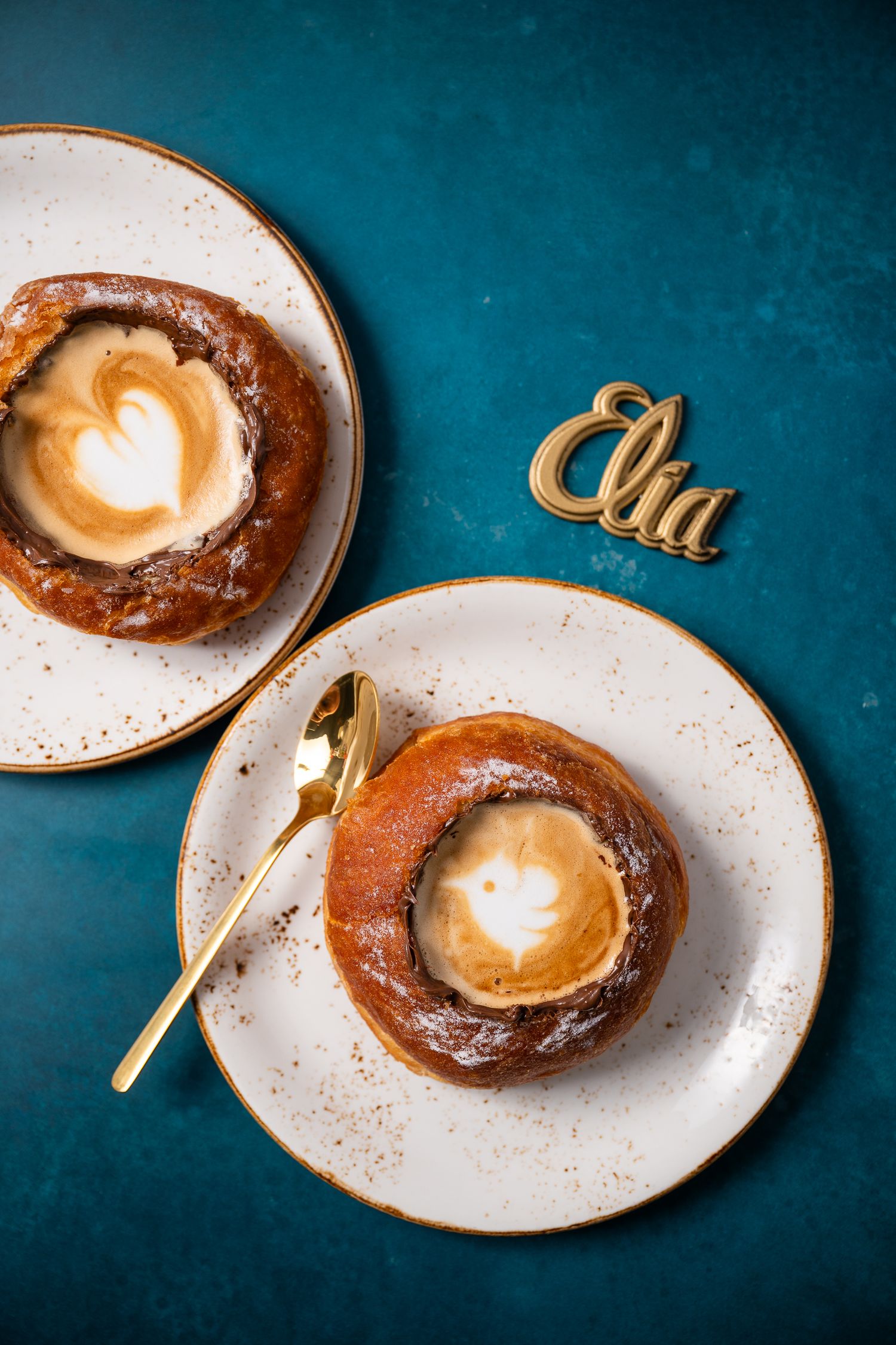 Elegant plated desserts with caramel drizzle served on white dishes against a dark blue background.