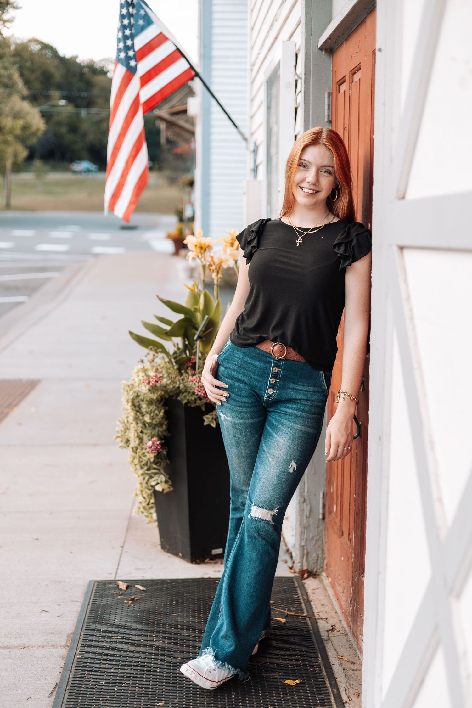 Casual street style portrait with American flag and planters with Kenzie Ayla Images in the Twin Cities MN area.
