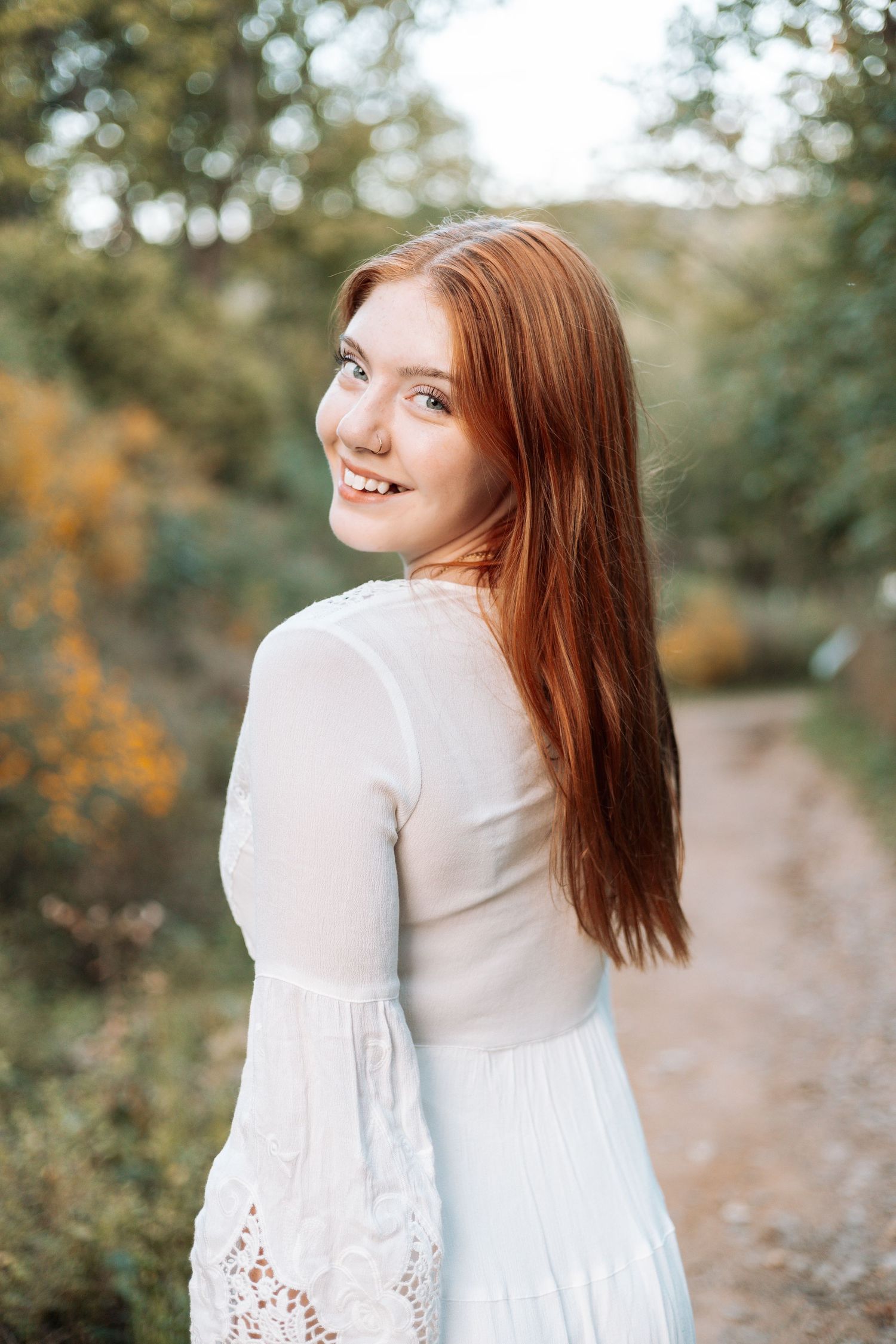 Portrait in white dress on nature path during golden hour with Kenzie Ayla Images in the Twin Cities MN area.