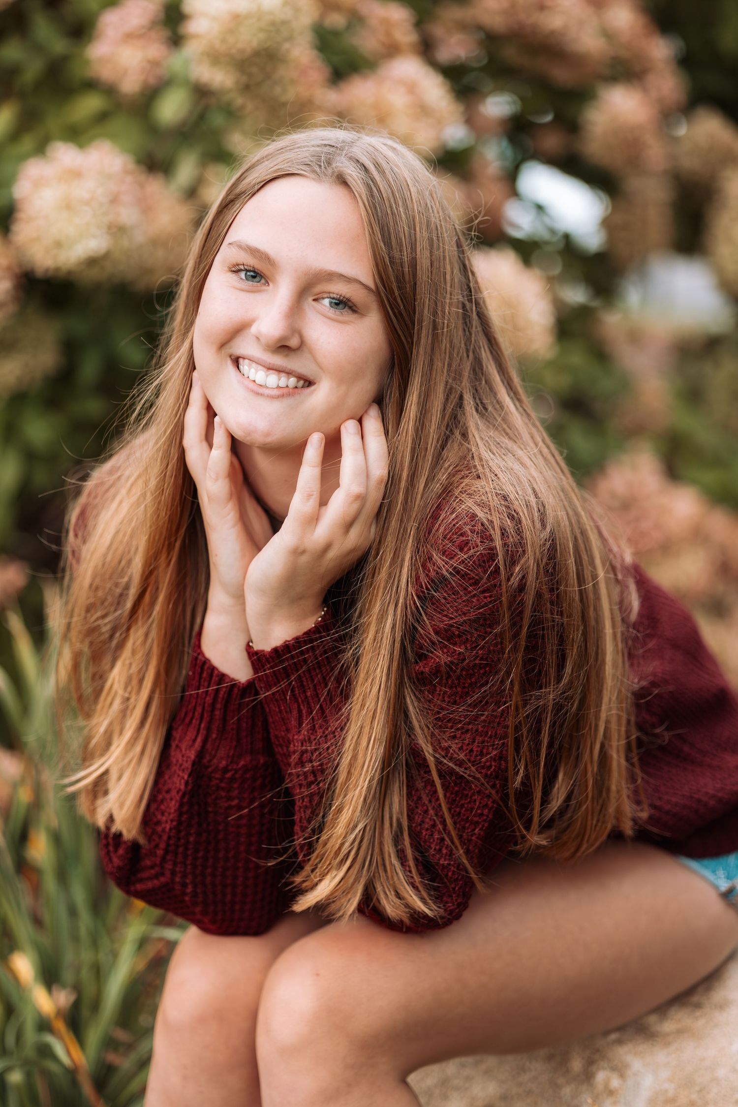 A series of autumn portraits showing someone in a burgundy sweater relaxing outdoors among fall foliage.
