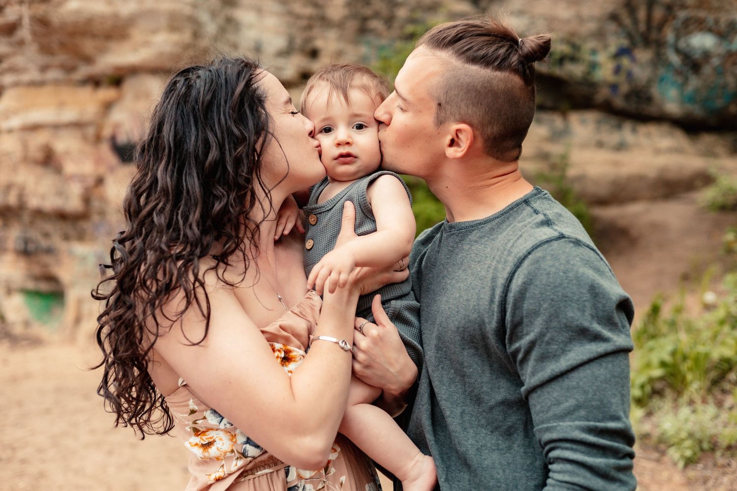 A family shares tender moments together against a natural backdrop in a series of candid photos.