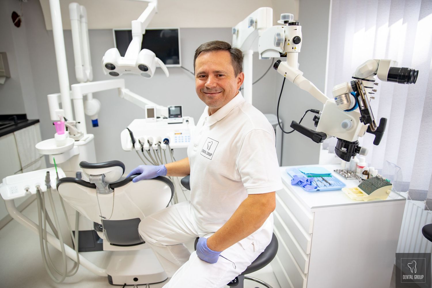 Modern dental office interior with advanced medical equipment and examination chairs.