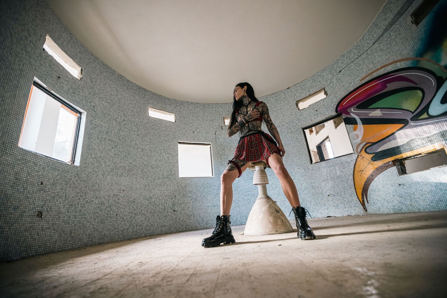 Artistic angles capture movement in an abandoned concrete space with natural lighting.