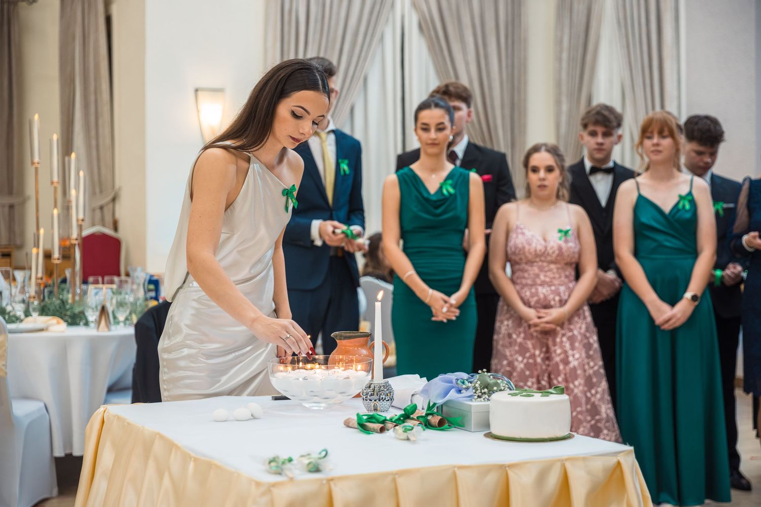Wedding reception setup with elegant table settings and decorations in banquet hall.