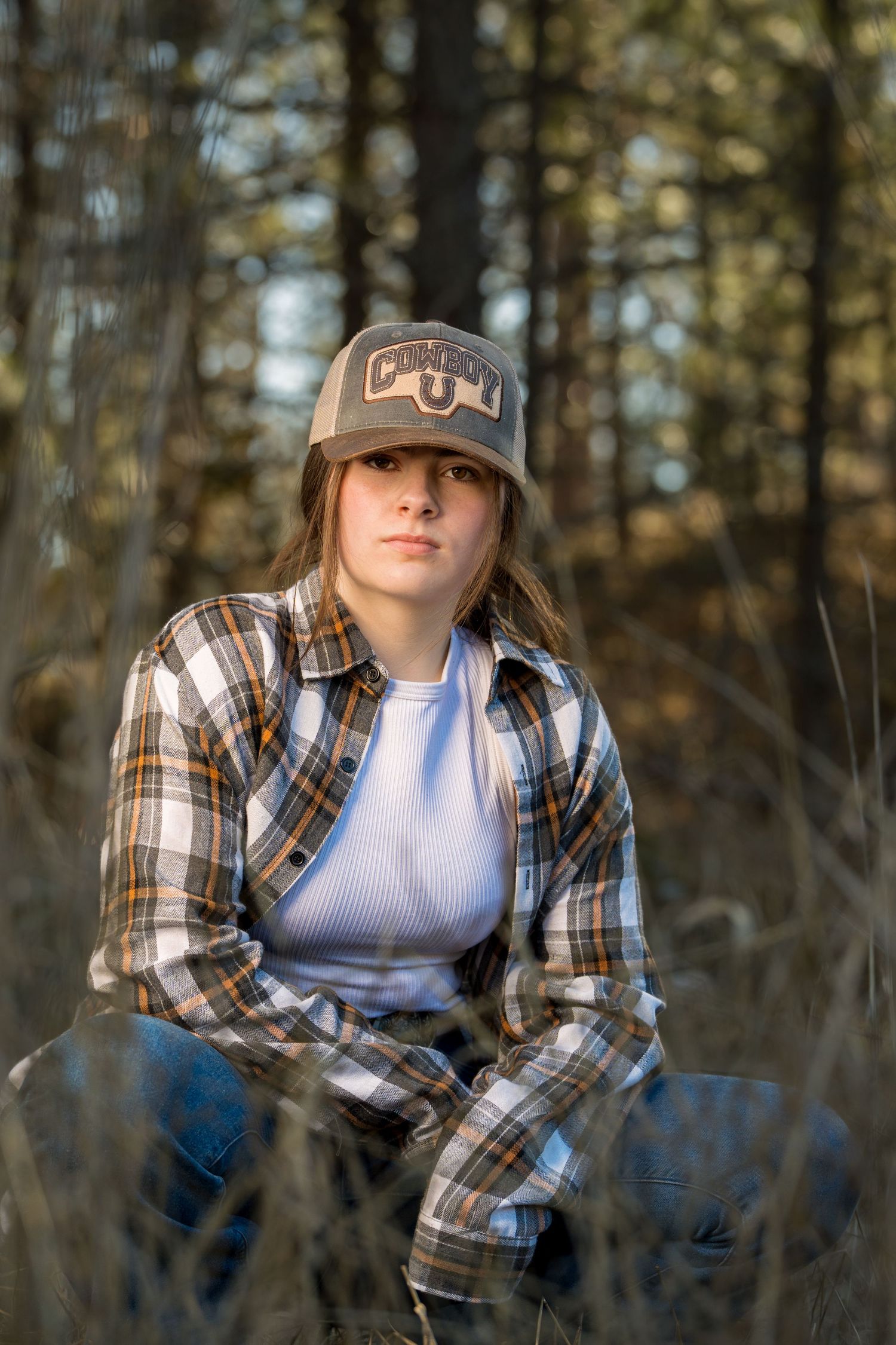 Casual outdoor portrait captured among the trees.