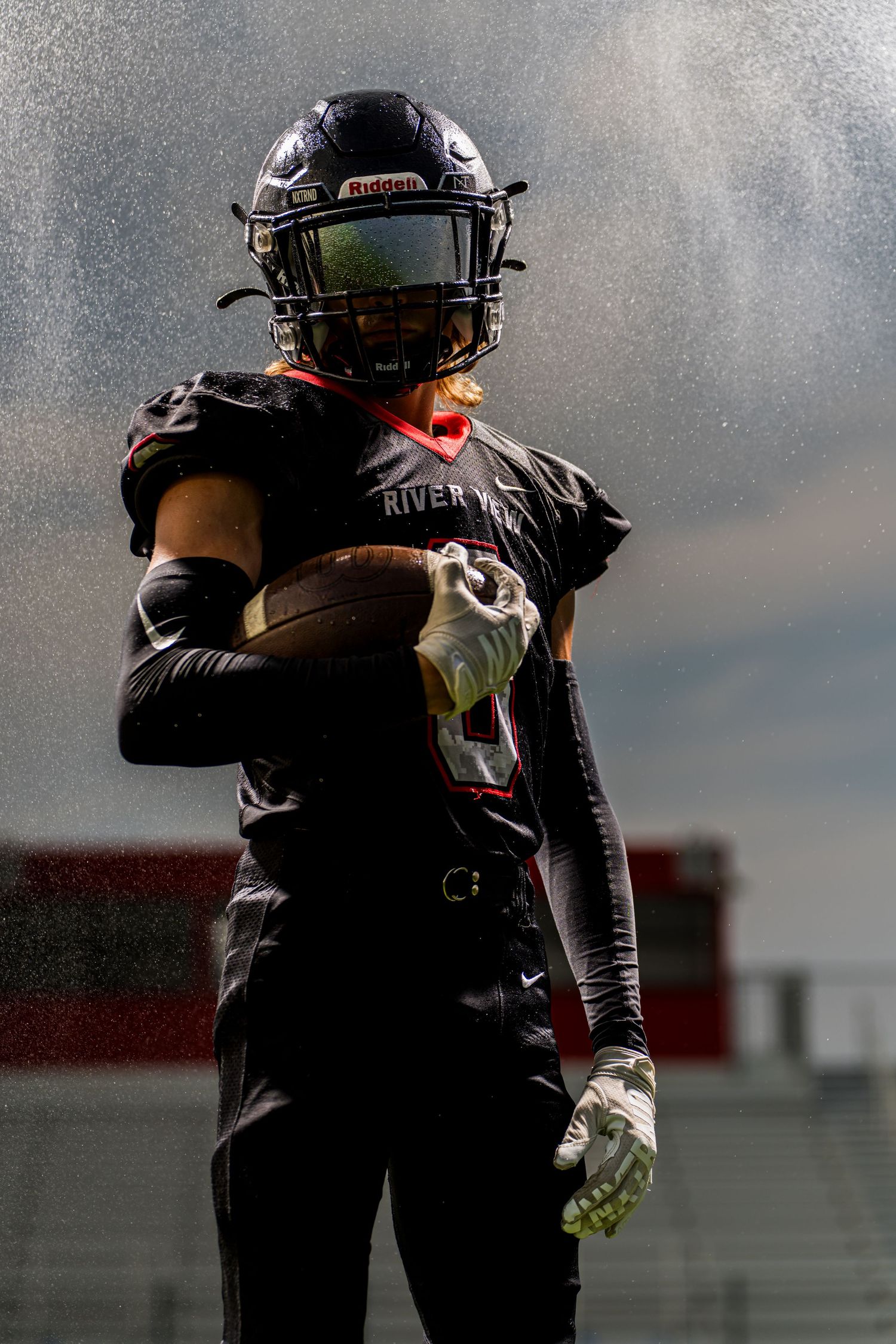Football player in uniform and helmet.