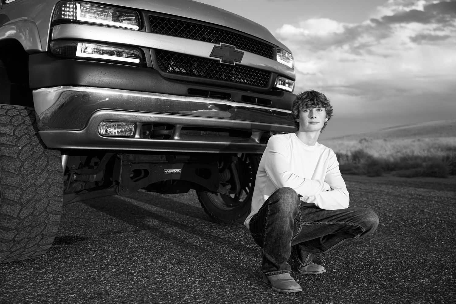 Black and white photo series showing low angle shots of car undercarriage and wheels.