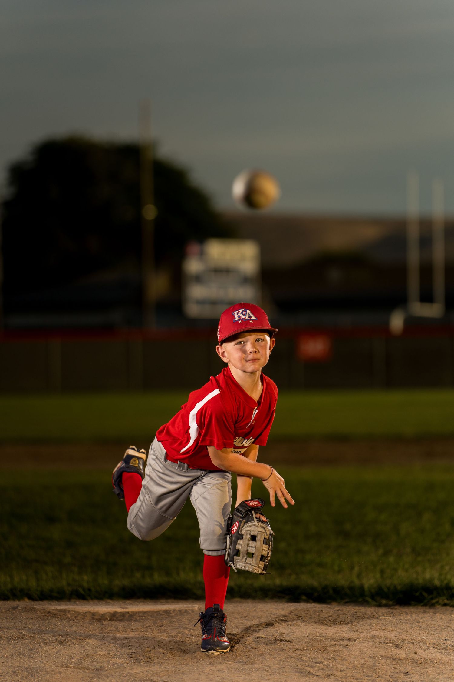 Youth baseball player pitching on field captured by Dillon Lane Photography in Tri Cities WA showcasing energy, focus, and sports passion.