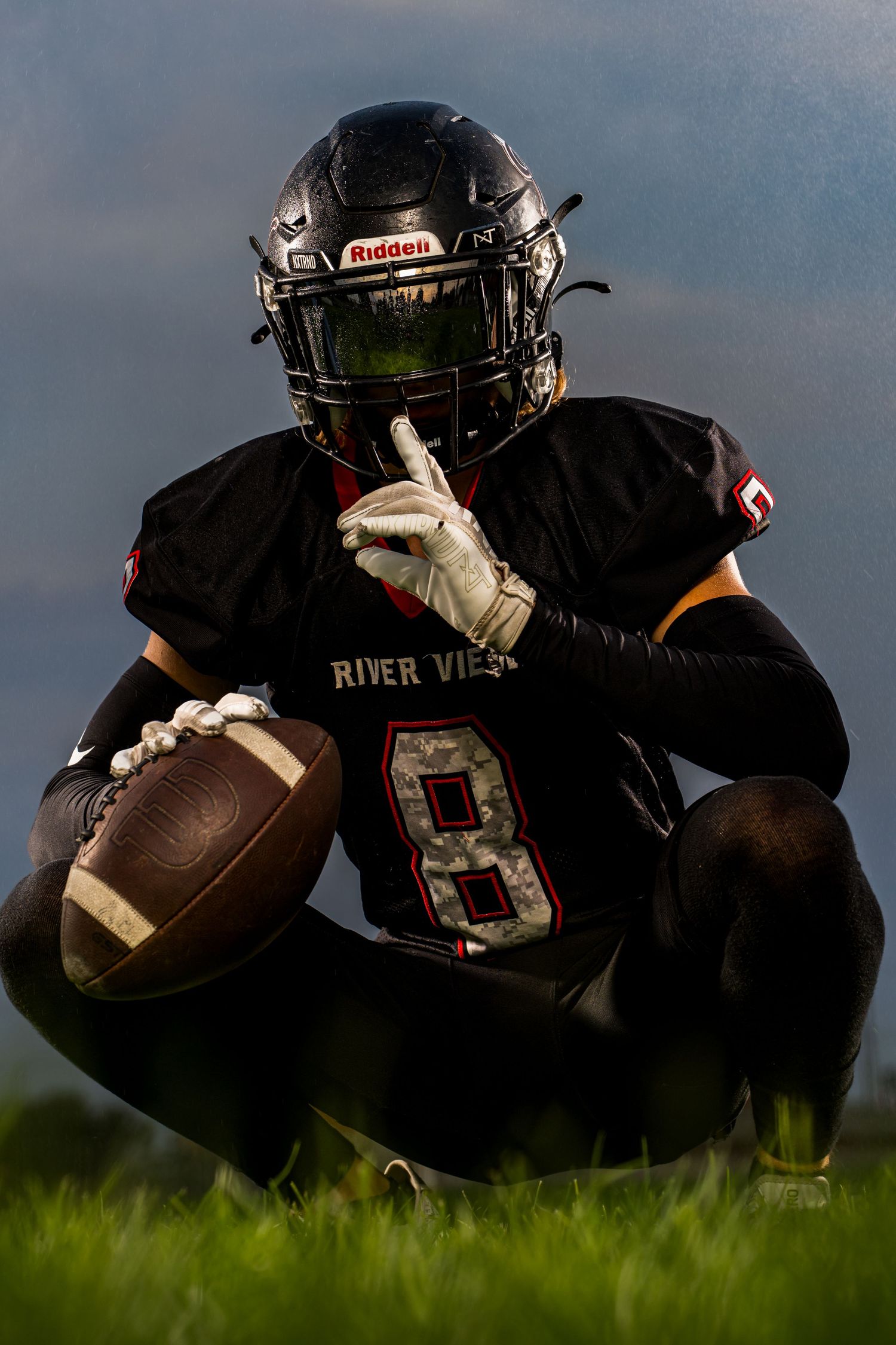 Football Media Day portrait for Riverview team in Tri Cities WA captured by Dillon Lane Photography showcasing bold lighting and attitude.