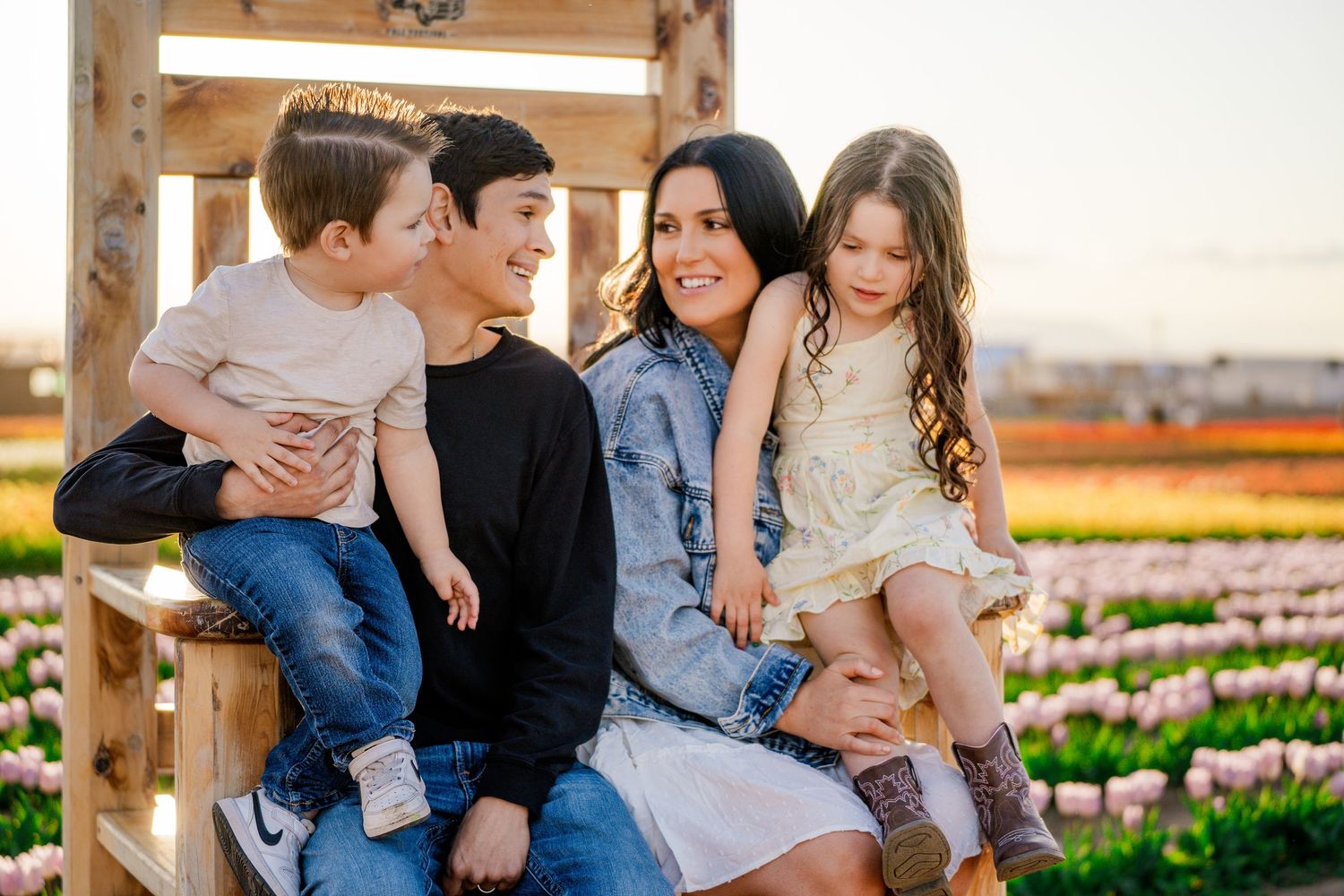 Family session in tulip fields at golden hour captured by Dillon Lane Photography in Tri Cities WA showcasing joy, color, and connection.