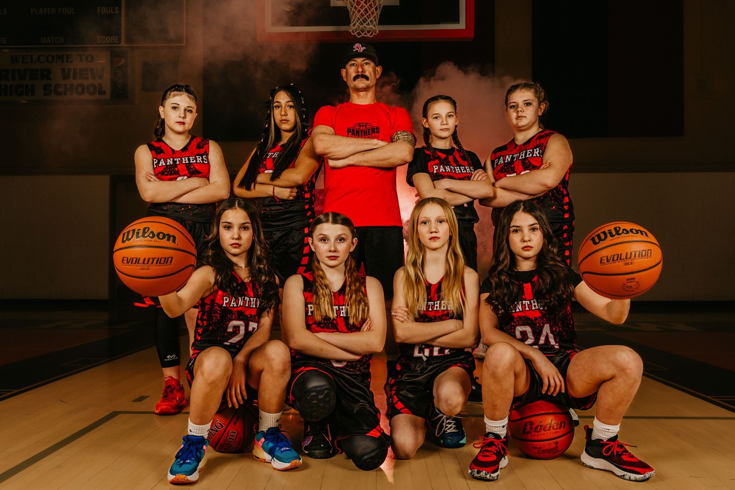 Girls basketball Media Day team portrait captured by Dillon Lane Photography in Tri Cities WA showcasing power, unity, and bold lighting.