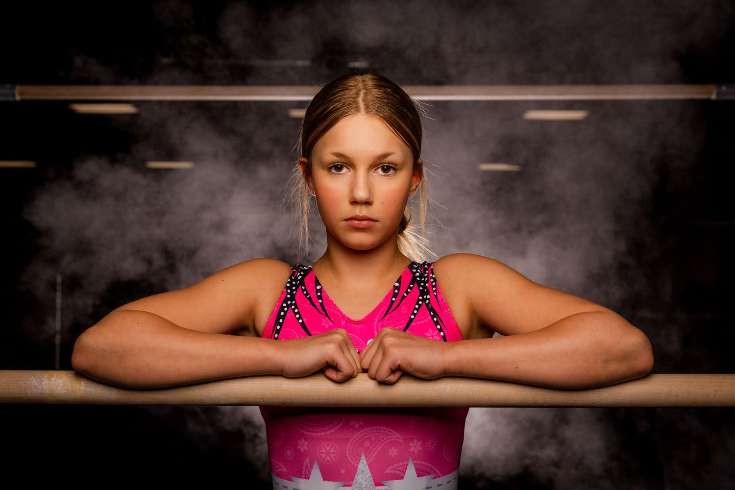 Gymnast portrait at Media Day with dynamic lighting and confident pose captured by Dillon Lane Photography in Eastern Washington.