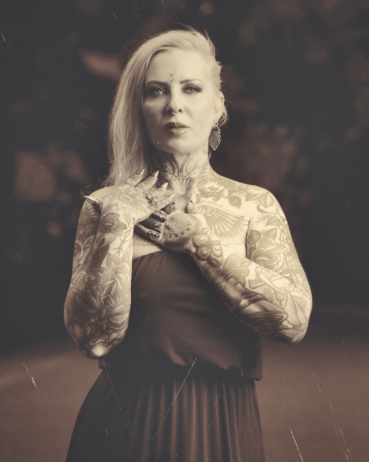 Model Mimi Fulton An artistic vintage-style portrait showcasing intricate white lace details against a dark background.