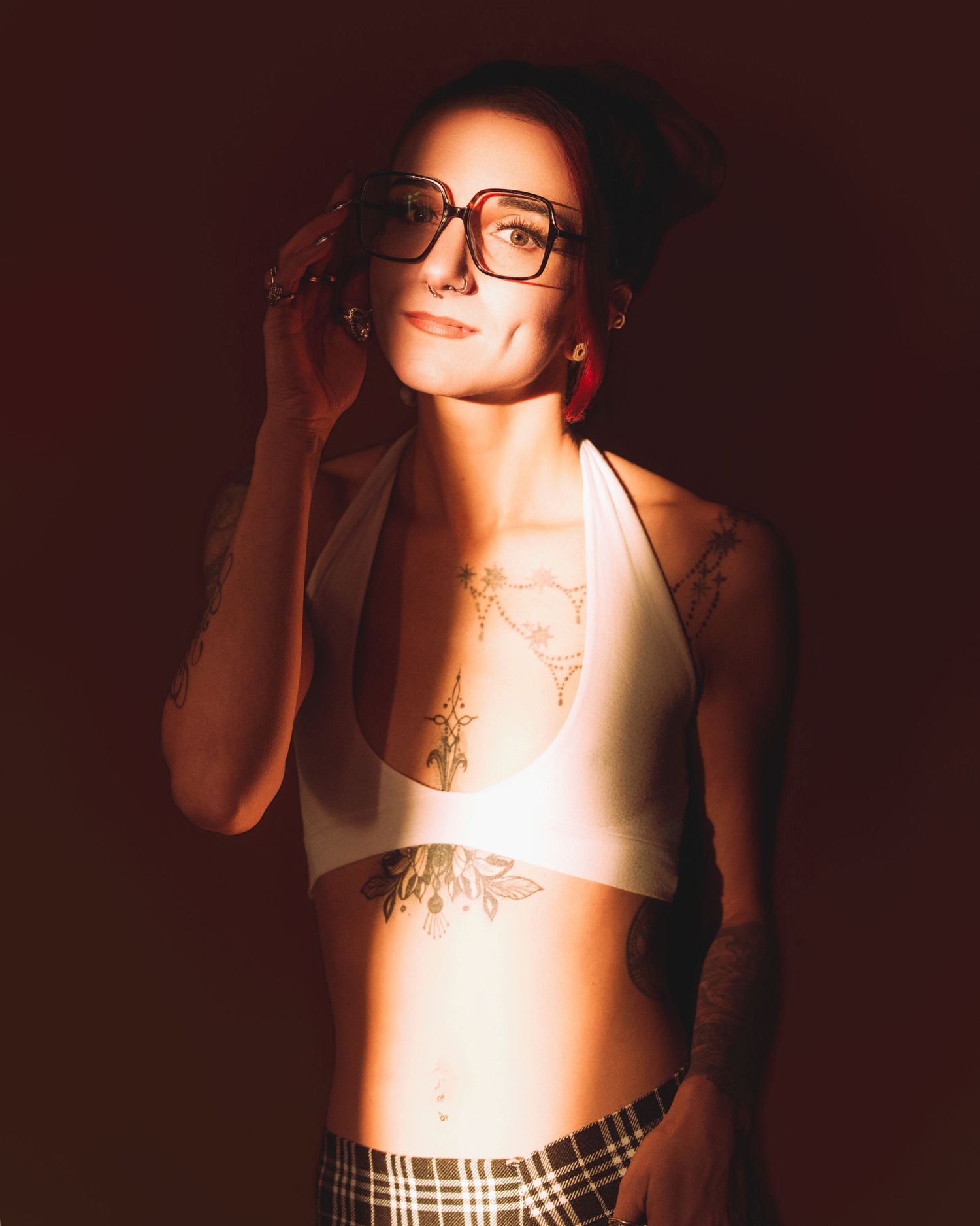 Artistic boudoir photography series showing dramatic shadows and lighting effects in warm tones.