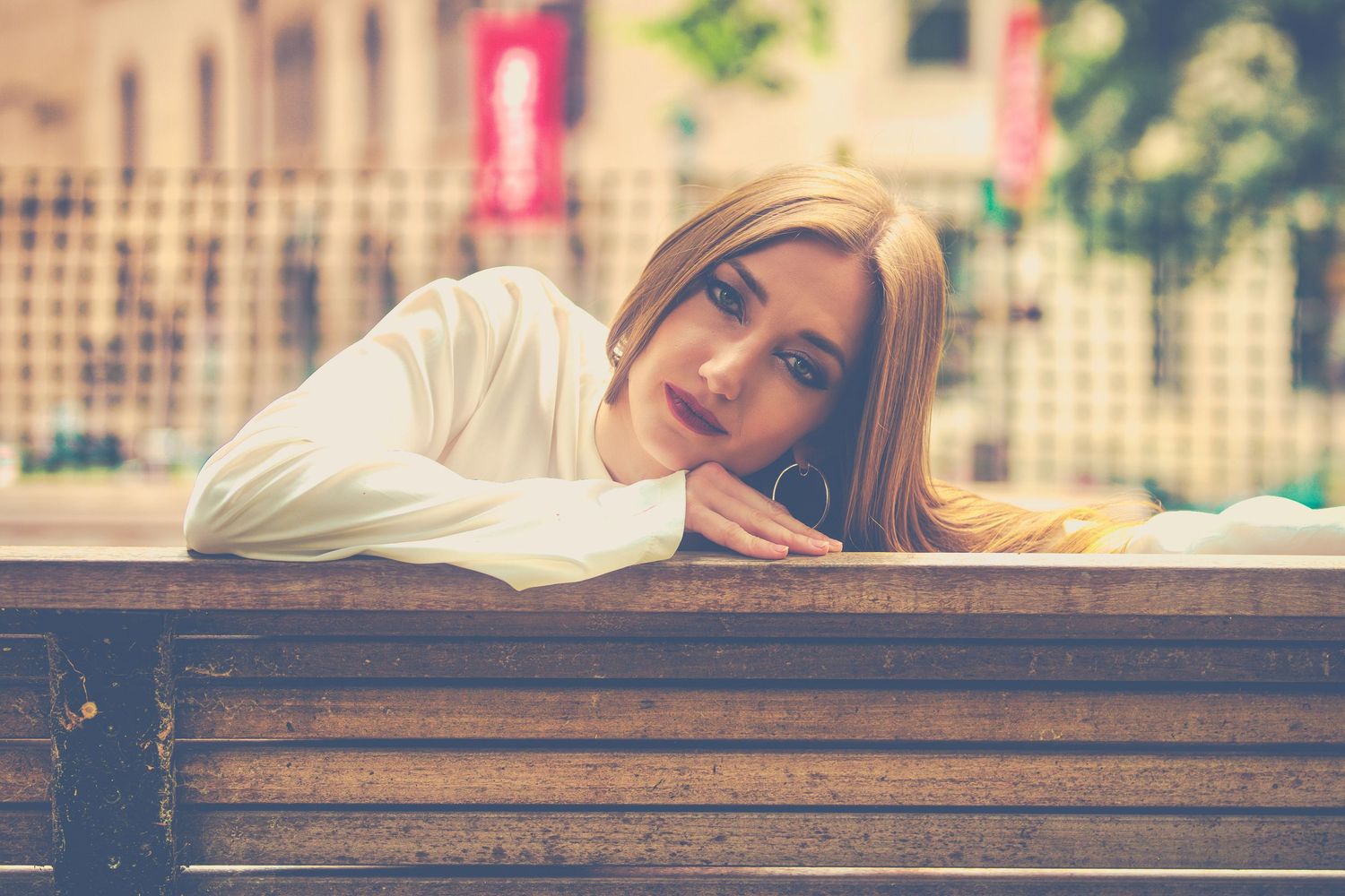 A diverse set of artistic portraits of a woman showcasing different poses and lighting effects.