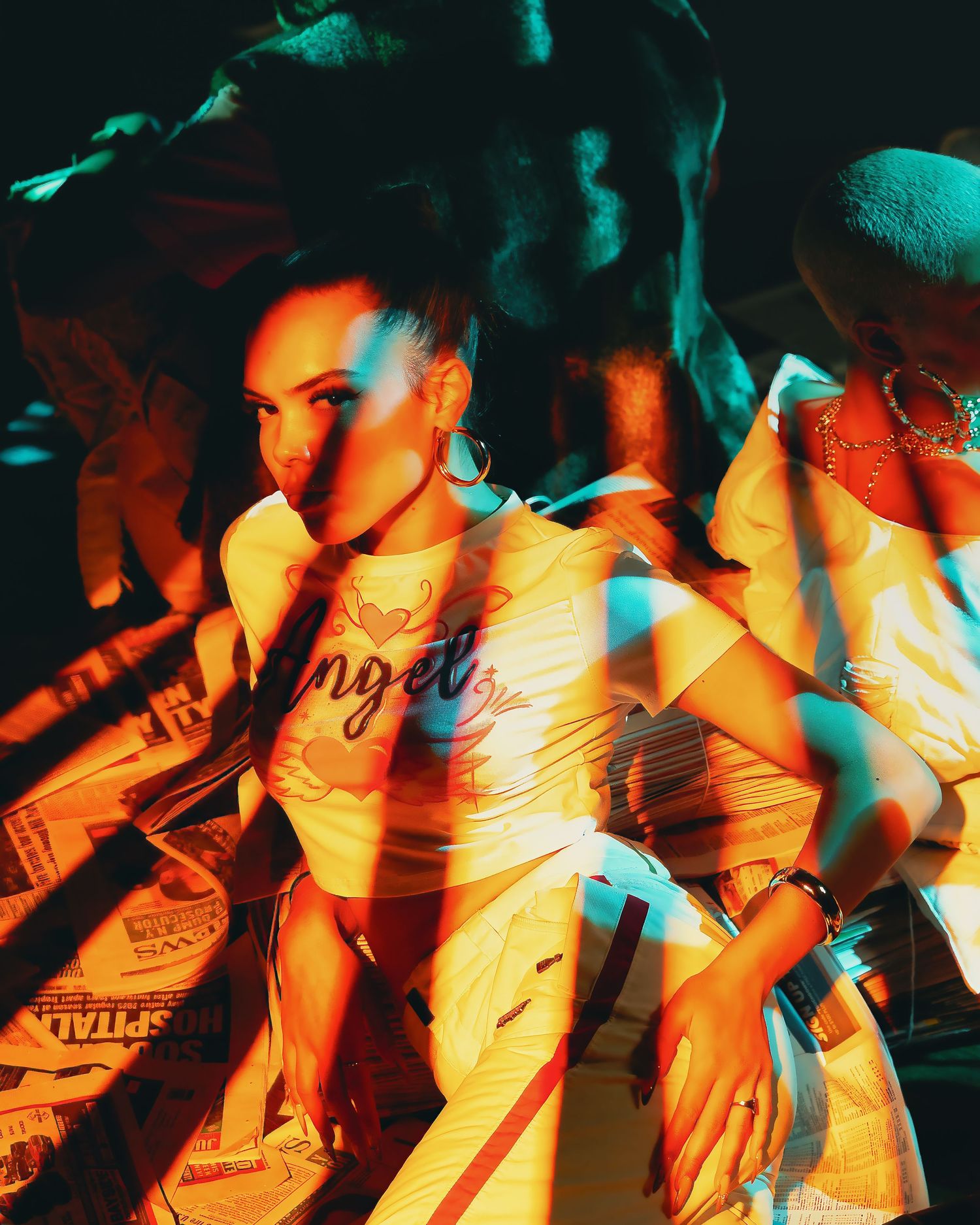 Multiple overlapping motion blur photos with warm orange and teal lighting create an abstract artistic effect.