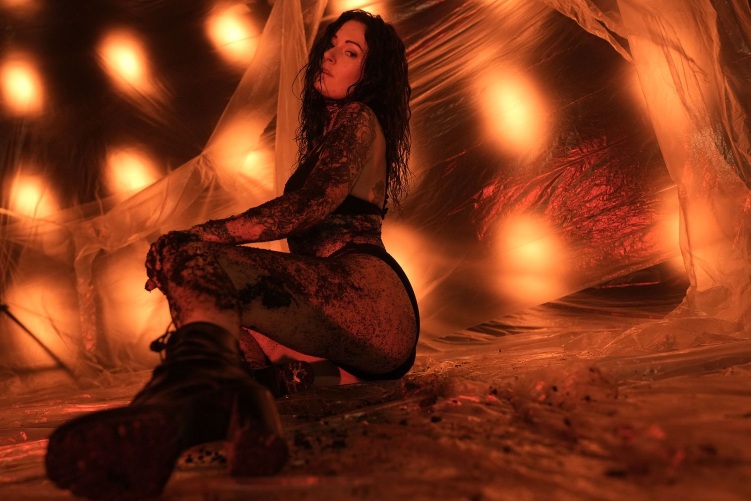 Glowing orange lights illuminate a dark cave interior creating a warm atmospheric ambiance.