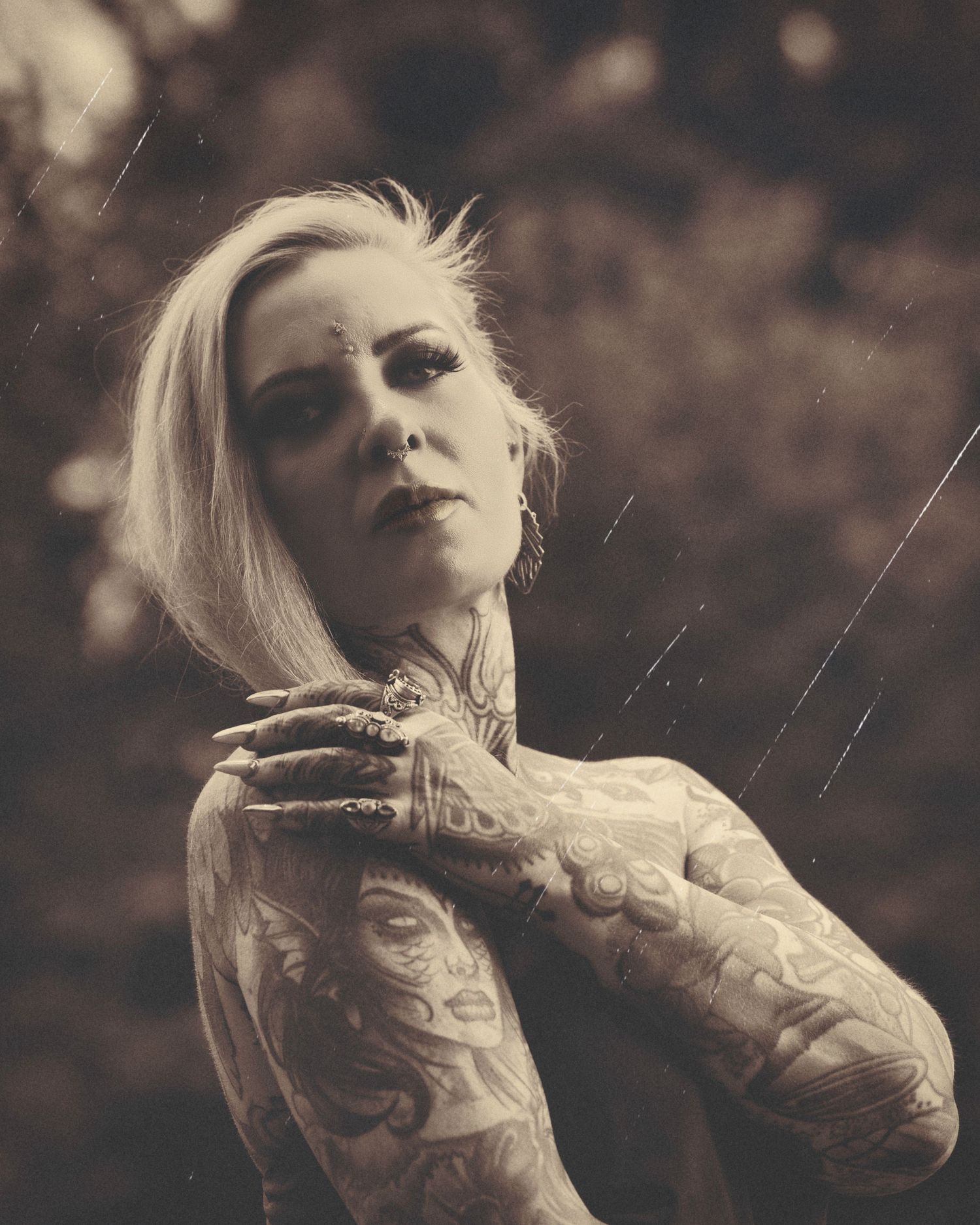 Monochromatic fashion series with ethereal styling and dramatic poses in sepia tones.