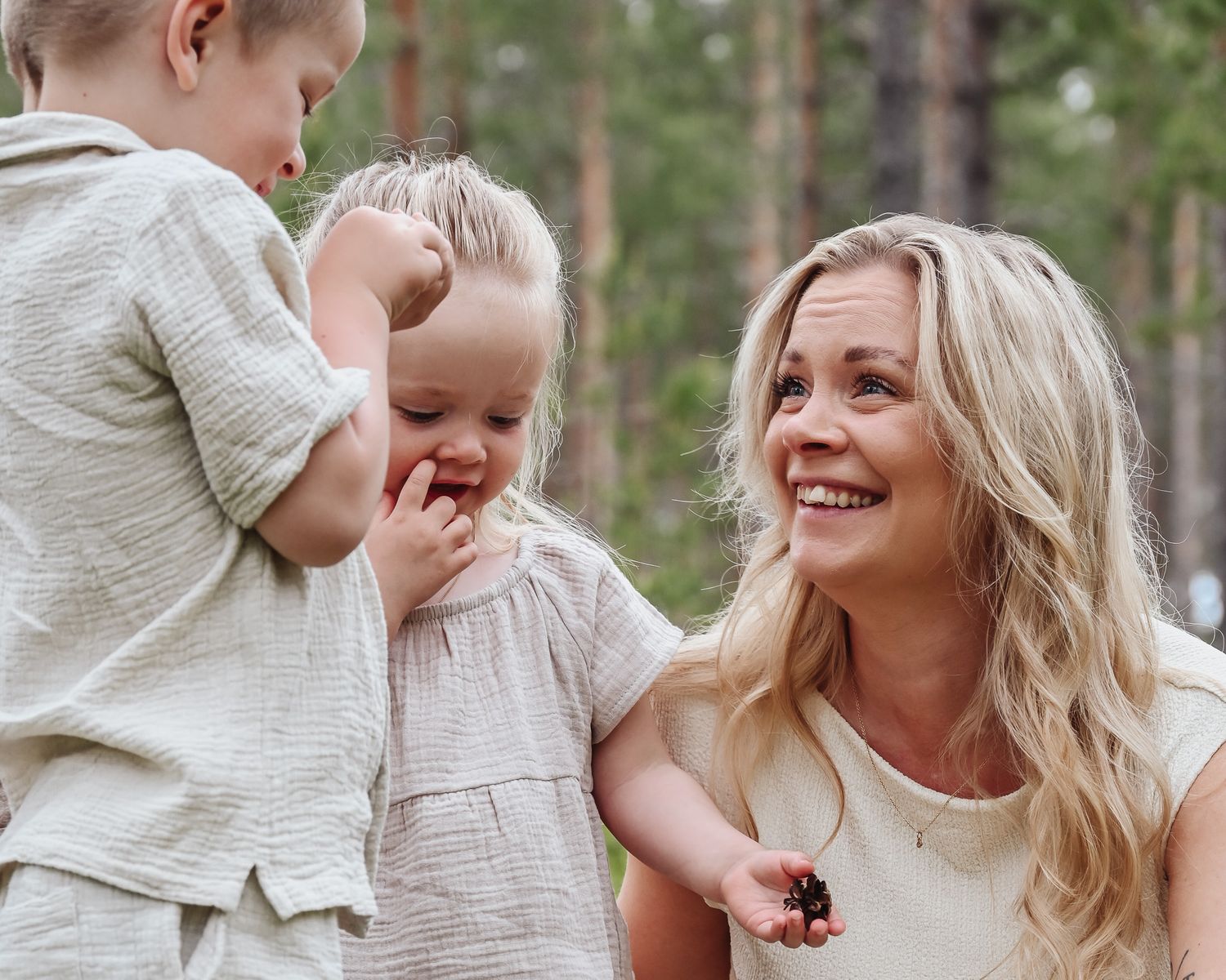 A joyful family moment captured in a series of candid outdoor photos showing playful interactions in a forest setting.