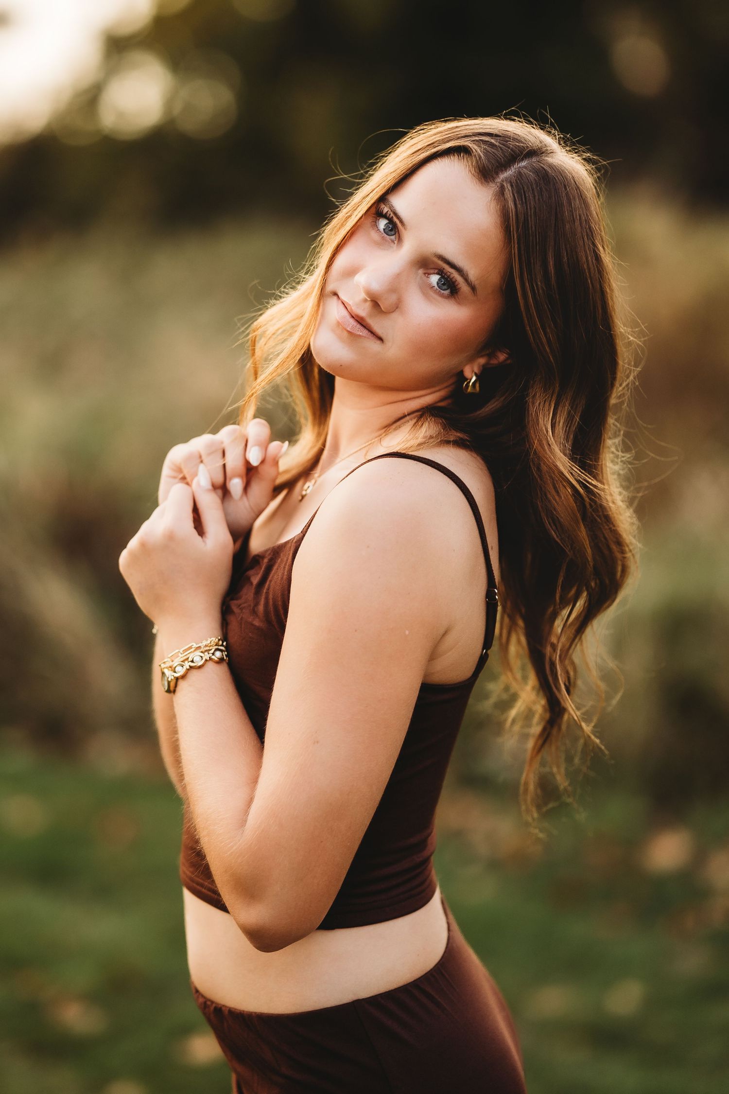 A series of outdoor portrait photos showing a person in a brown tank top posing against a natural background at sunset.