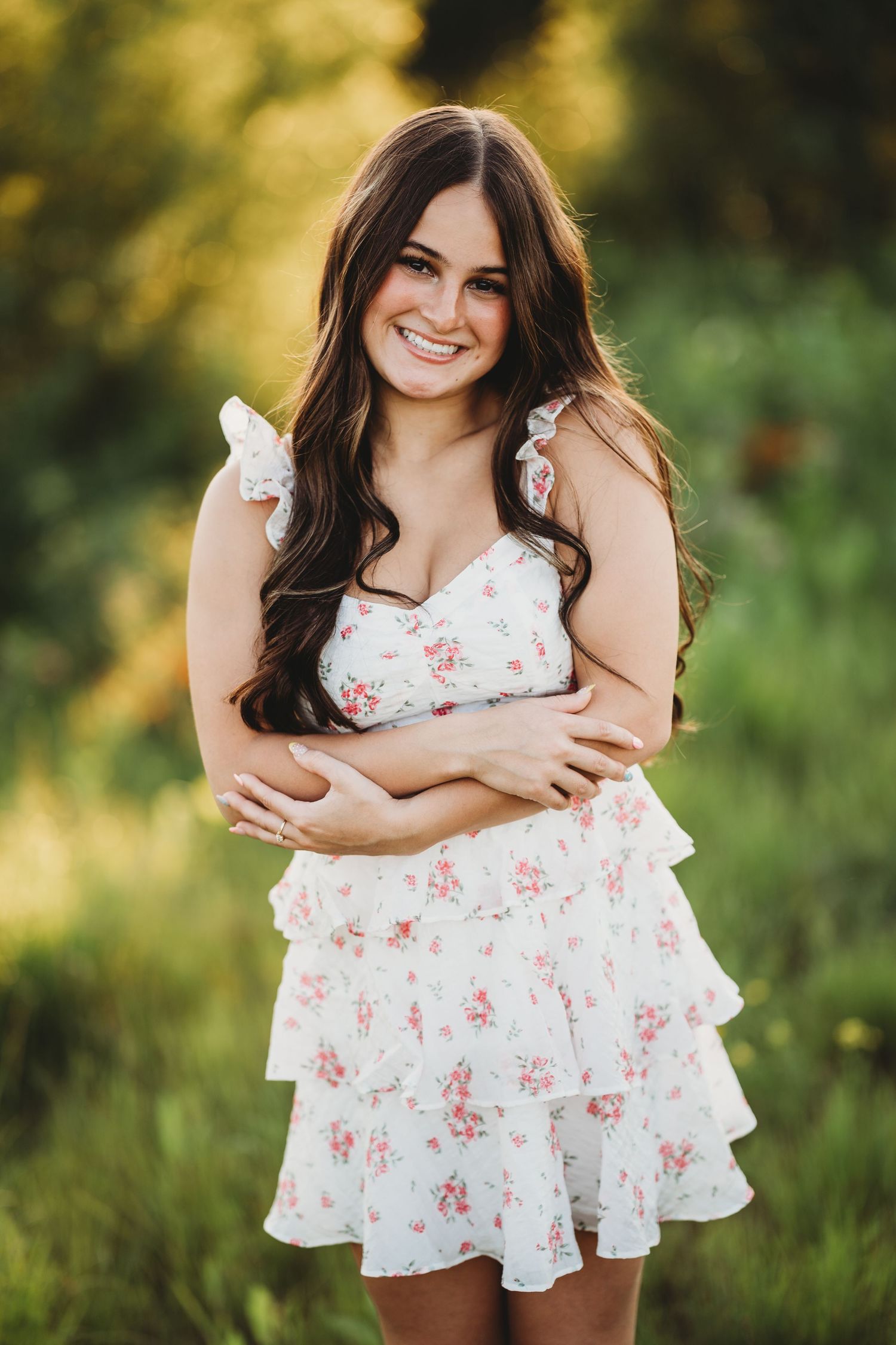 Summer portrait session in a white floral dress amidst natural greenery. Senior Minnesota