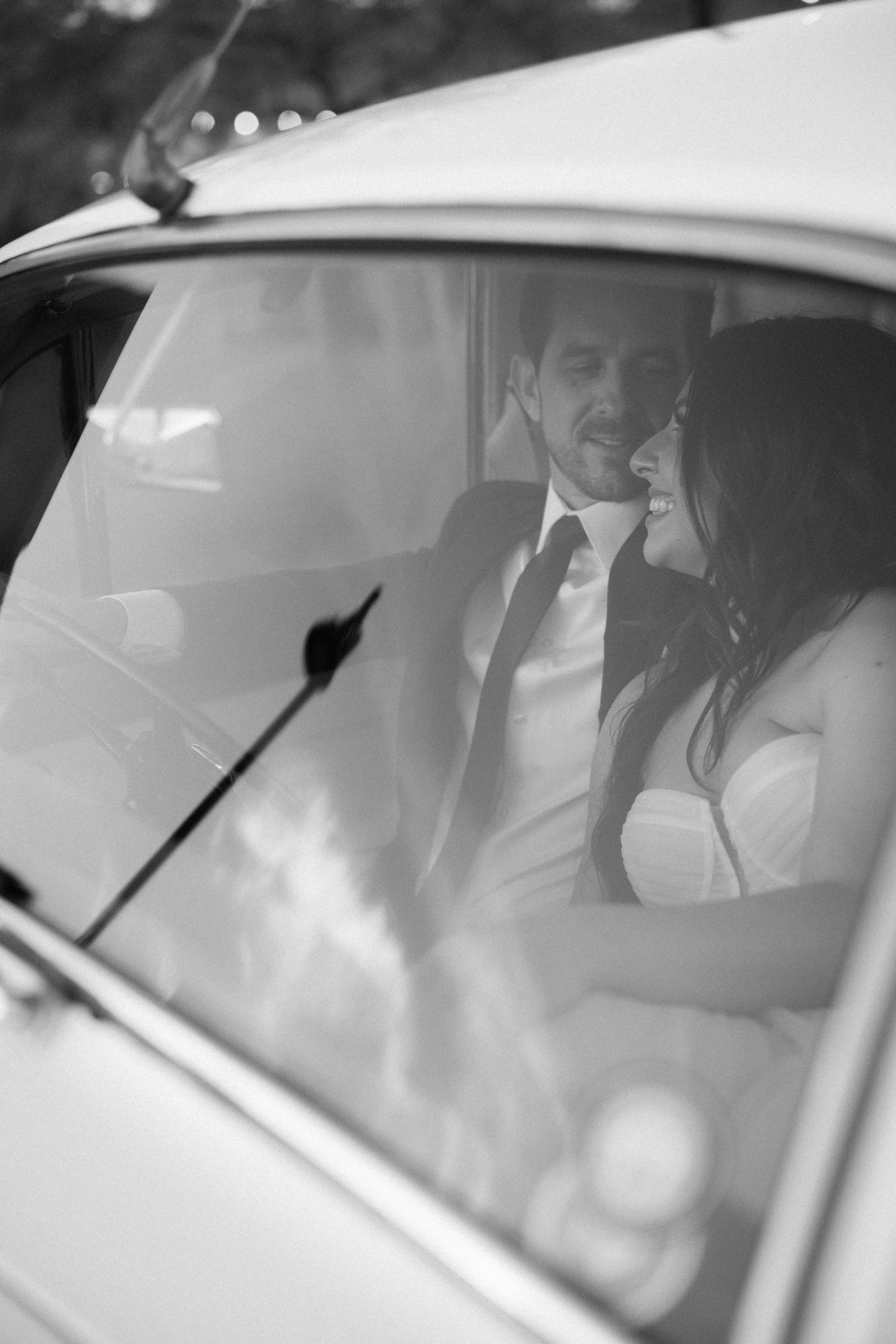 A series of black and white photographs showing a person seated in a car with sunlight streaming through the windows.