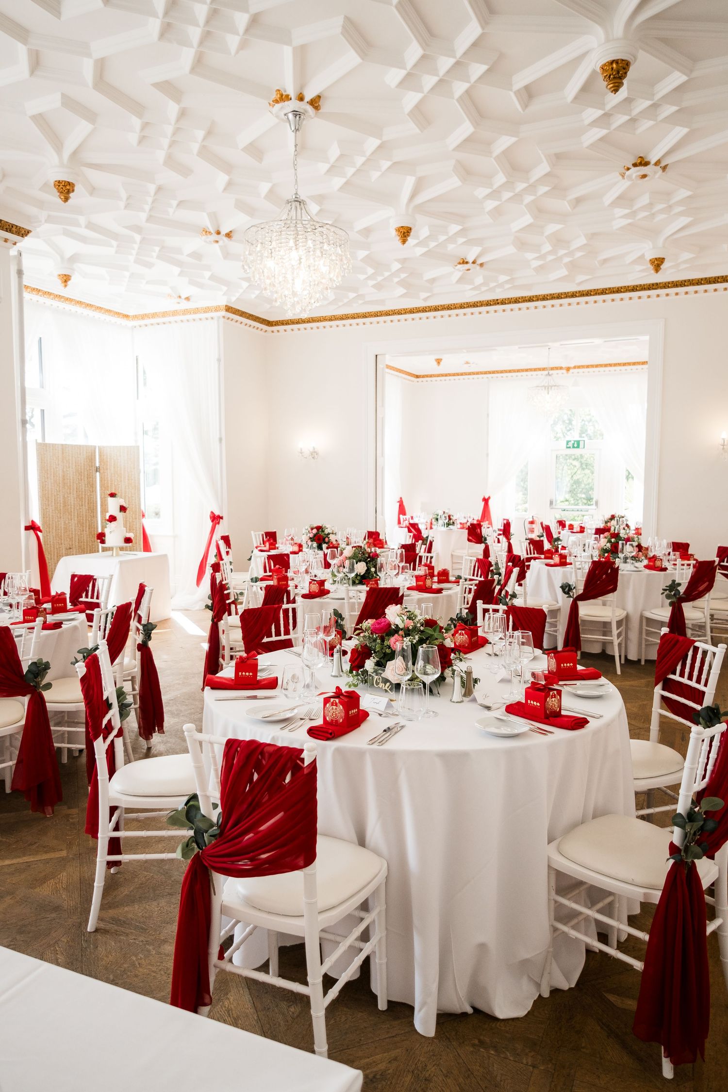 Elegant reception setup with red and white styling at Highley Manor.