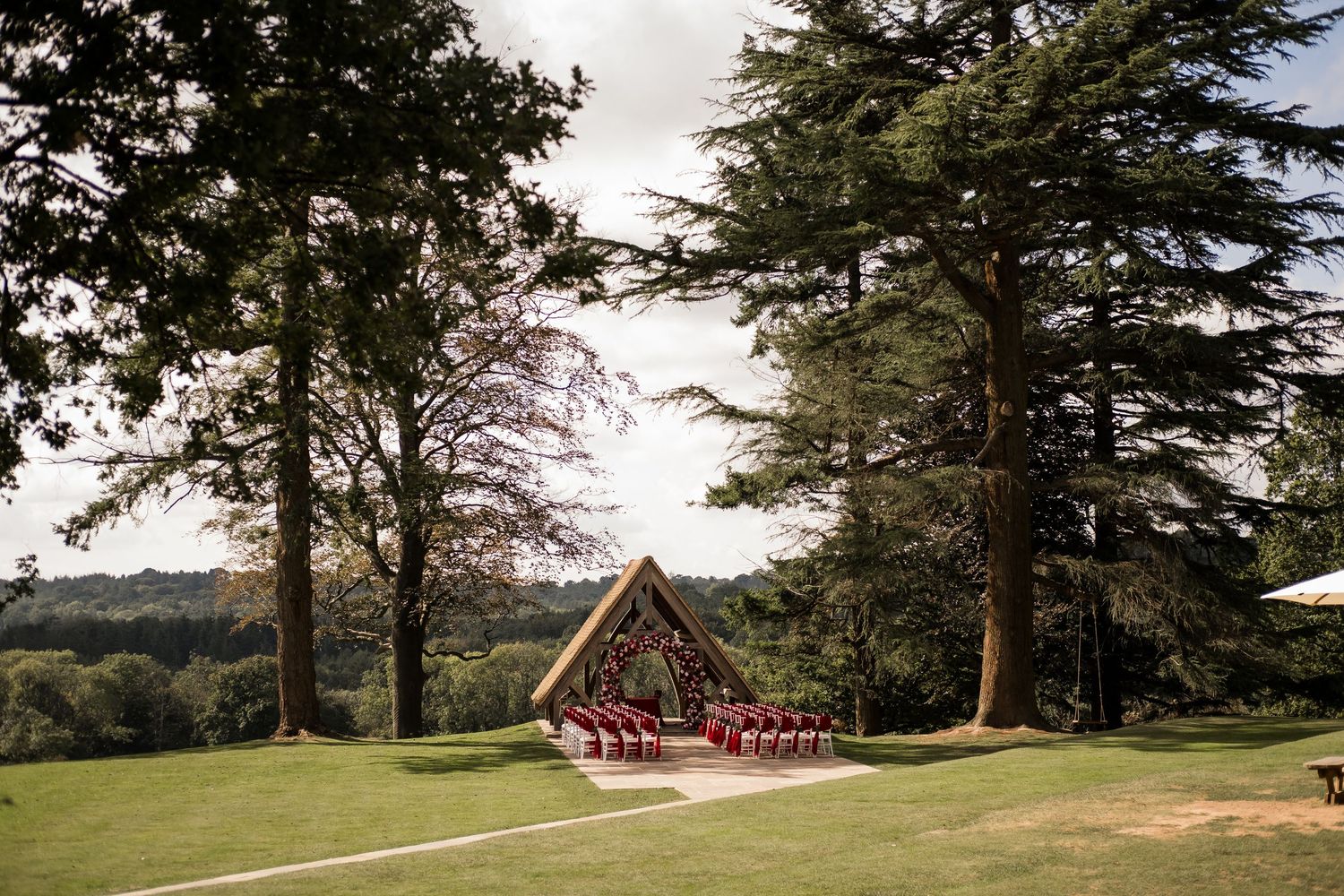 Highley Manor wedding venue in West Sussex with rolling countryside views on a sunny summer day.