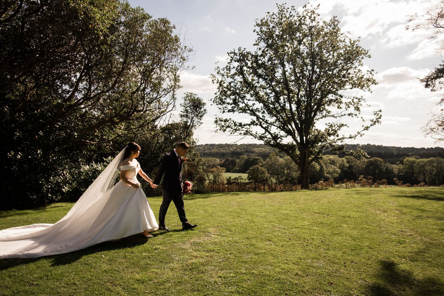 Romantic newlywed portraits overlooking the countryside at Highley Manor.