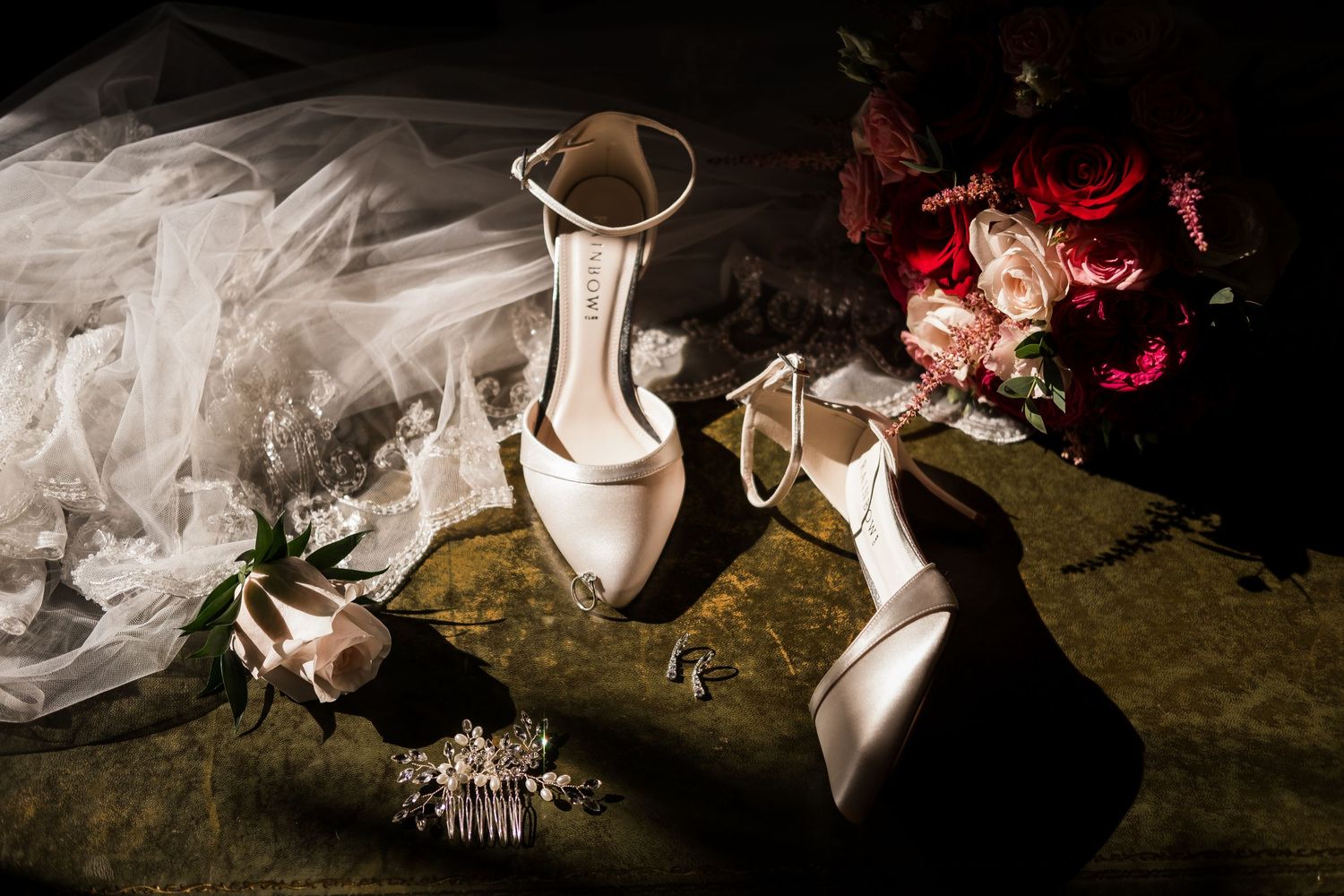 A series of wedding detail photos showing white bridal shoes and delicate floral arrangements on a dark background.