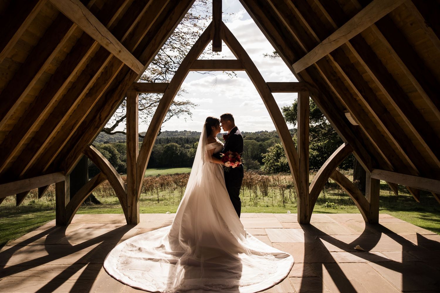 A wooden barn or covered bridge interior framing structure shown in a series of connected architectural detail shots.