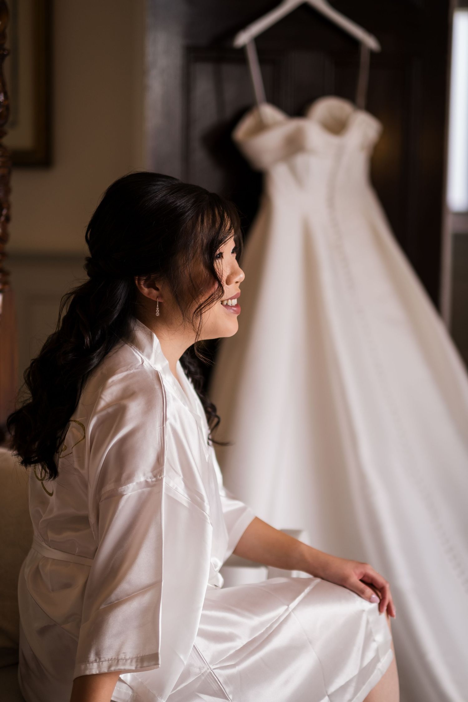 Bride having her hair and makeup done before her Highley Manor summer wedding.