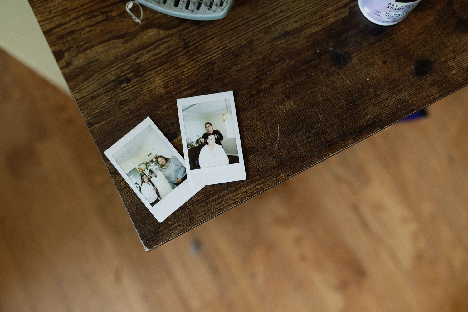 Wedding photos displayed on rustic wooden surface with vintage styling in Birmingham, AL.