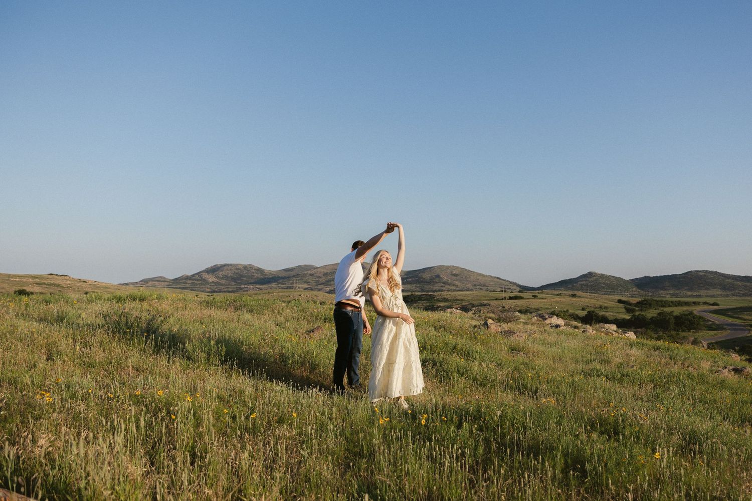 Panoramic landscape series showing distant wedding photography shots in a vast grassy field.