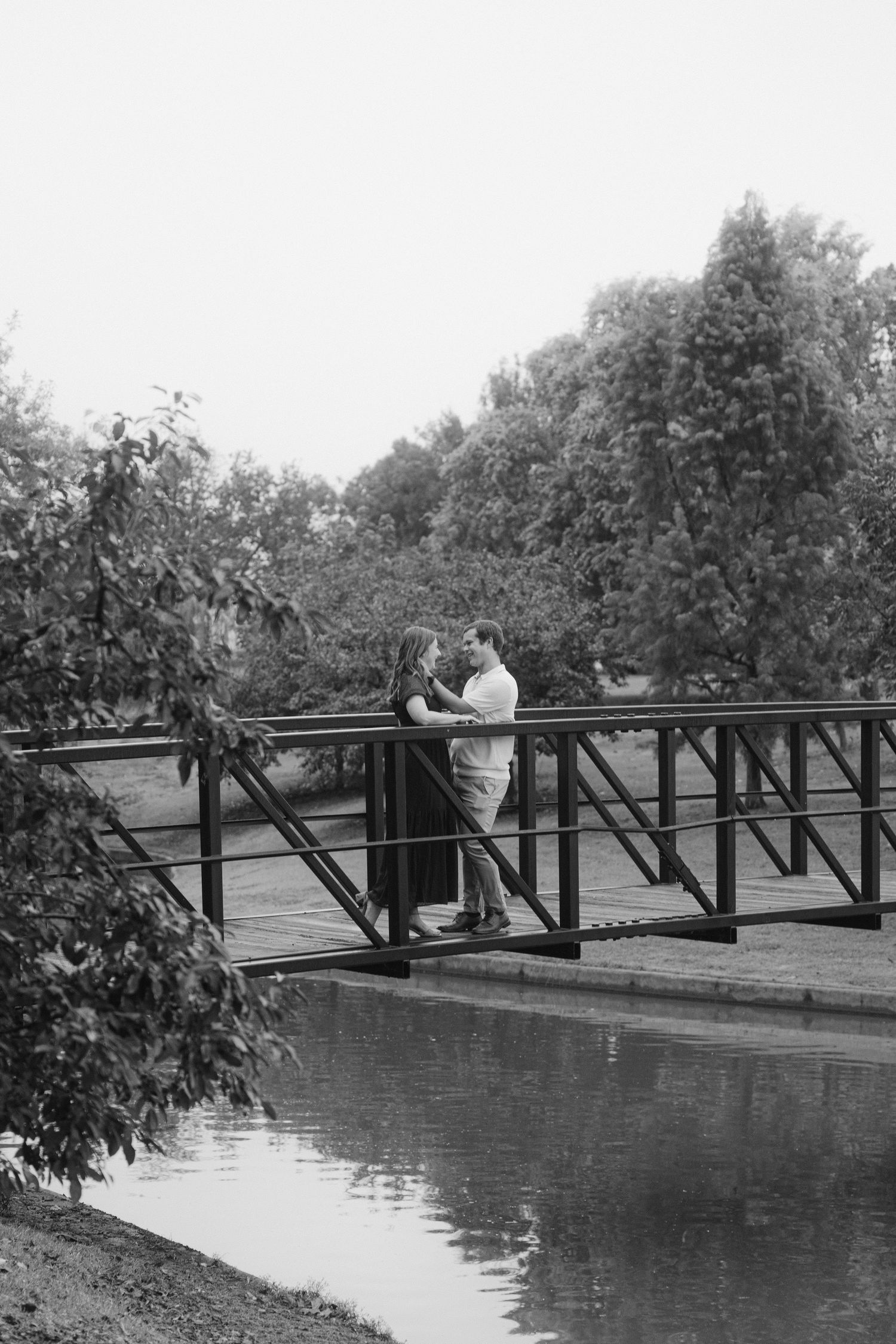 A black and white photo sequence shows a person falling off a bridge into water in four progressive stages.