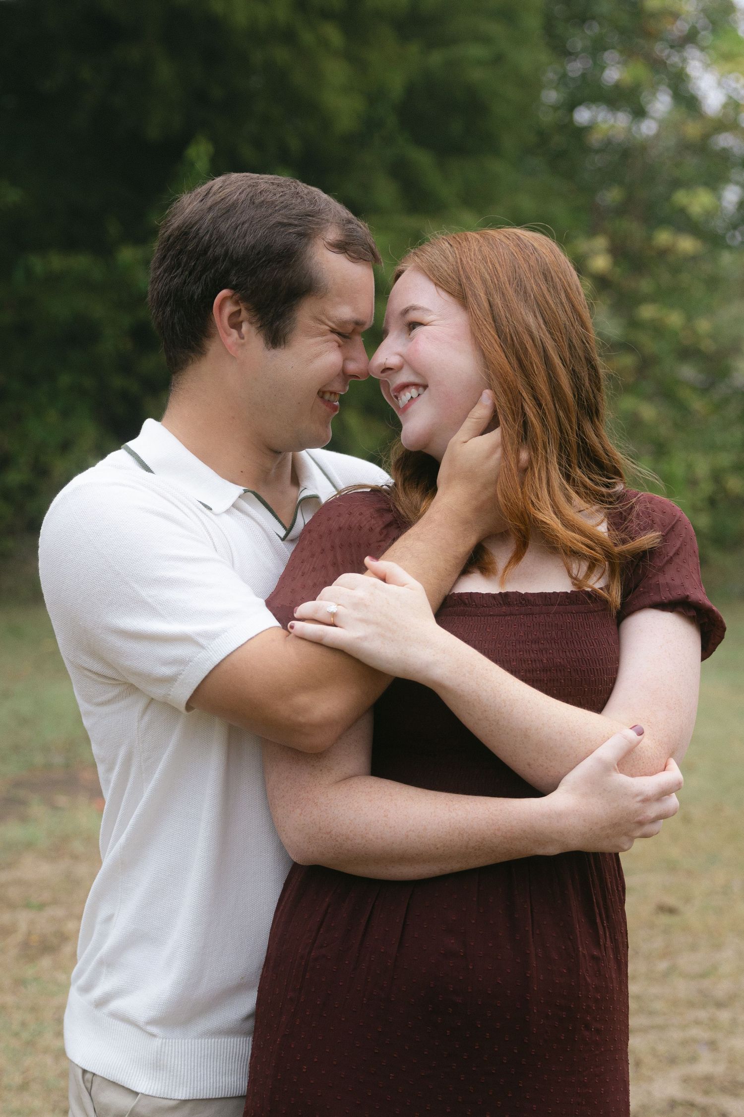 A couple embraces and shares a tender moment outdoors in a series of romantic candid photos.