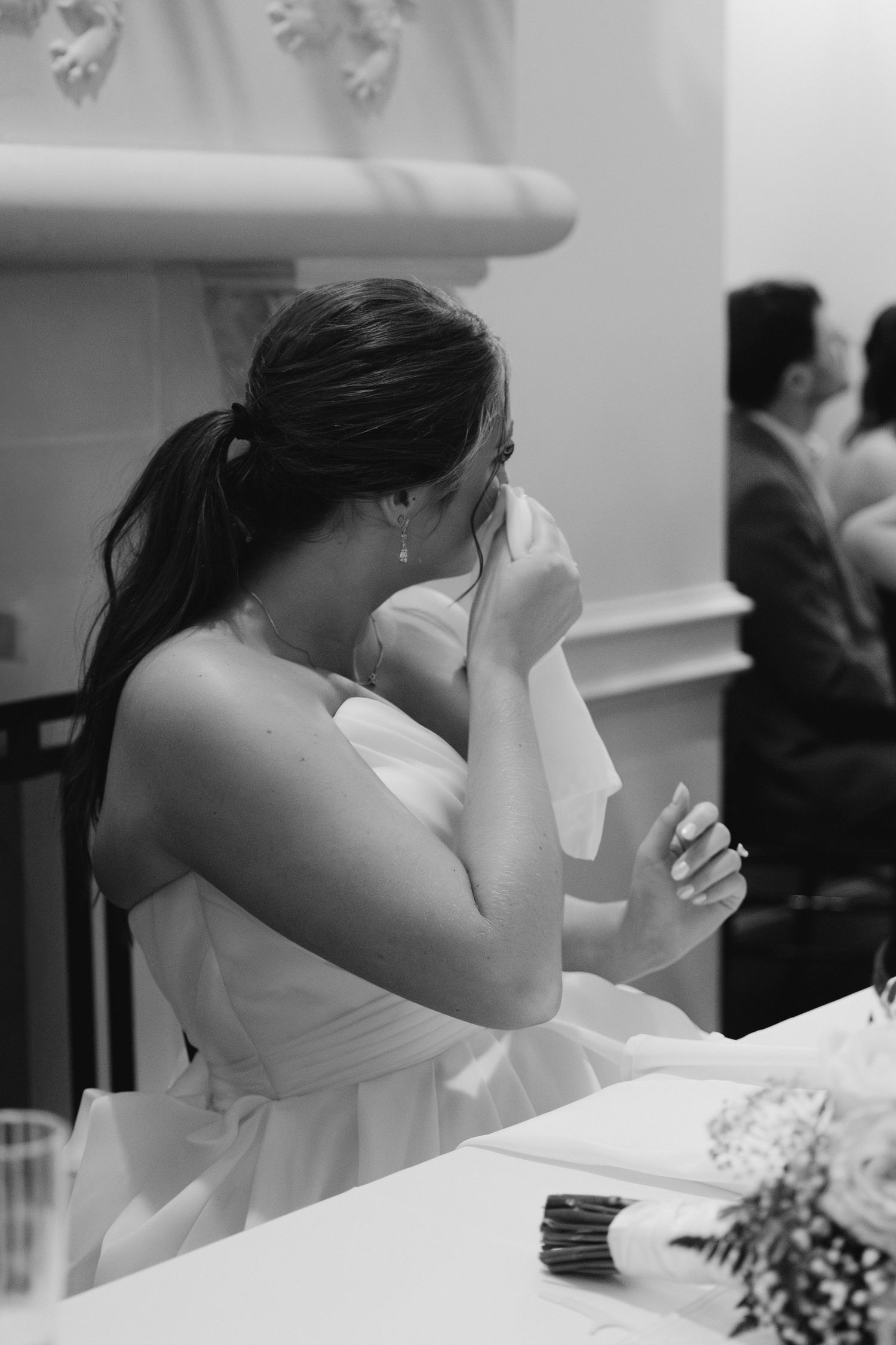Emotional wedding sequence showing bride wiping tears during ceremony.